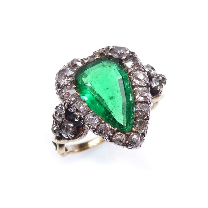 Pear shaped emerald and diamond cluster ring